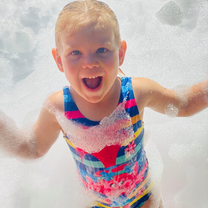 Child enjoying a Jumpingwithus foam party